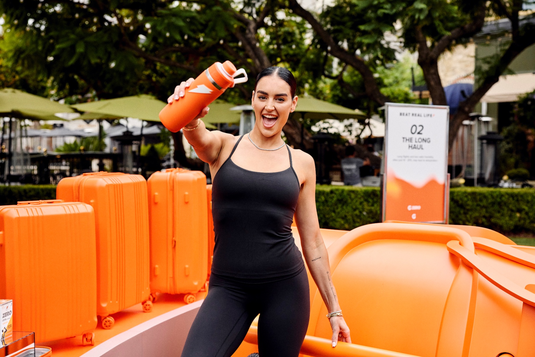 Brand ambassador holding a Propel bottle at an outdoor activation